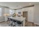 Modern kitchen featuring a large island, white cabinetry, and stainless steel appliances at 11300 N Casa Dega Dr # 1019, Surprise, AZ 85388