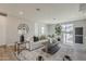 Elegant living room with a stylish white sofa, side table, and decorative clock at 11300 N Casa Dega Dr # 1019, Surprise, AZ 85388