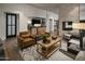 Inviting lounge featuring cozy seating, fireplace and entertainment area at 11300 N Casa Dega Dr # 1019, Surprise, AZ 85388