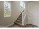 Bright staircase featuring hardwood floors and contemporary white railing at 11300 N Casa Dega Dr # 1019, Surprise, AZ 85388