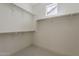 Bright walk-in closet with ample shelving and storage, offering organized and convenient space at 11300 N Casa Dega Dr # 1019, Surprise, AZ 85388