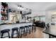 Open concept bar with ample storage, granite countertops, and seating for six at 12601 W San Miguel Ave, Litchfield Park, AZ 85340