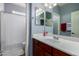 Bathroom featuring a vanity with a white sink and a shower with a patterned shower curtain at 12601 W San Miguel Ave, Litchfield Park, AZ 85340