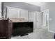 Bedroom showcasing a closet with sliding doors, gray walls, and view into an adjoining hallway at 12601 W San Miguel Ave, Litchfield Park, AZ 85340