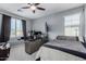 This bedroom boasts ample natural light, a ceiling fan, and a modern workspace for ultimate convenience at 12601 W San Miguel Ave, Litchfield Park, AZ 85340