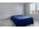 Comfortable bedroom with neutral tones, featuring a plush bed and window providing natural light and views at 12601 W San Miguel Ave, Litchfield Park, AZ 85340