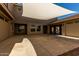 A covered carport provides ample space with natural light from the courtyard above at 12601 W San Miguel Ave, Litchfield Park, AZ 85340