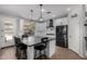 Stylish kitchen with white cabinets, granite countertops, stainless steel appliances, and a breakfast bar at 12601 W San Miguel Ave, Litchfield Park, AZ 85340