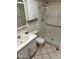Bathroom featuring a sink vanity, toilet, and accessible shower stall at 13603 N 111Th Ave, Sun City, AZ 85351