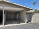 Home with an attached carport featuring a secure entrance and providing covered parking at 13603 N 111Th Ave, Sun City, AZ 85351