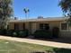 Charming single-story home with well-maintained landscaping and covered entry at 13603 N 111Th Ave, Sun City, AZ 85351