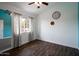 Bedroom featuring hardwood floors, ceiling fan, and natural light from window at 1406 E Jasper Dr, Chandler, AZ 85225