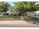 Charming two-story home showcasing mature trees, a well-manicured lawn, and a welcoming facade at 1406 E Jasper Dr, Chandler, AZ 85225