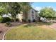 Lush front yard with mature trees, landscaping, and manicured lawn at 1406 E Jasper Dr, Chandler, AZ 85225