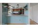 Modern kitchen with custom cabinets, a breakfast bar, and stainless steel appliances at 1406 E Jasper Dr, Chandler, AZ 85225