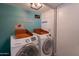Laundry room features Samsung washer and dryer with laundry service decor at 1406 E Jasper Dr, Chandler, AZ 85225