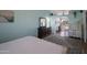Main bedroom featuring hardwood floors, bright blue walls, and natural lighting at 1406 E Jasper Dr, Chandler, AZ 85225