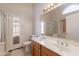 Bathroom featuring a double vanity sink and tile flooring at 15128 W Melissa Ln, Surprise, AZ 85374