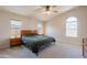 Bright bedroom featuring modern furniture, neutral carpet, and natural light at 15128 W Melissa Ln, Surprise, AZ 85374