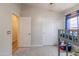A bedroom with a loft bed, closet, and window at 15128 W Melissa Ln, Surprise, AZ 85374