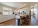 Bright kitchen with white cabinets, butcher block island, stainless steel appliances, and eat-in bar seating at 15128 W Melissa Ln, Surprise, AZ 85374