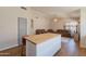 Kitchen with a wood-top island and view into a living room at 15128 W Melissa Ln, Surprise, AZ 85374
