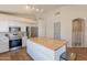 Bright kitchen featuring stainless steel appliances, white cabinetry, and a butcher block island at 15128 W Melissa Ln, Surprise, AZ 85374