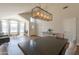Open concept living space featuring dining area and natural light at 15128 W Melissa Ln, Surprise, AZ 85374