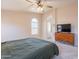 Inviting primary bedroom featuring walk-in closet, tv, and neutral carpet at 15128 W Melissa Ln, Surprise, AZ 85374
