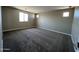 Cozy bedroom showcasing neutral walls, carpet flooring and a bright window enhancing the natural light at 17493 W Fulton St, Goodyear, AZ 85338