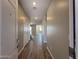 An entryway reveals beautiful wood-look tile flooring leading to a bright, open living space at 17493 W Fulton St, Goodyear, AZ 85338