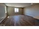 Bright and airy living room with hard surface floors and large windows at 17493 W Fulton St, Goodyear, AZ 85338
