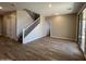 Spacious living area with hard surface floors and a staircase leading to the second floor at 17493 W Fulton St, Goodyear, AZ 85338