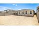 View of the home's backyard featuring block wall and space for customization at 17778 W Turquoise Ave, Waddell, AZ 85355