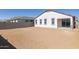 Large, private backyard awaiting landscaping, enclosed by a block wall, perfect for outdoor living and entertaining at 17778 W Turquoise Ave, Waddell, AZ 85355