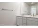 Bright bathroom with double sink vanity, neutral colors, and ample counter space at 17778 W Turquoise Ave, Waddell, AZ 85355