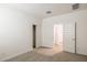 Bright bedroom featuring neutral carpet, a closet, and white trim at 17778 W Turquoise Ave, Waddell, AZ 85355