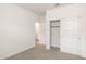 Bedroom with closet and access to other rooms at 17778 W Turquoise Ave, Waddell, AZ 85355
