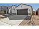 Inviting single-Gathering home features modern architecture, well-manicured yard, and a convenient two-car garage at 17778 W Turquoise Ave, Waddell, AZ 85355