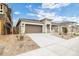 Inviting single-story home with a spacious driveway, a two-car garage, and low-maintenance landscaping at 17778 W Turquoise Ave, Waddell, AZ 85355