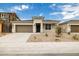 Beautiful single-story home with a spacious driveway, a two-car garage, and low-maintenance landscaping at 17778 W Turquoise Ave, Waddell, AZ 85355