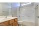 Bathroom features a tub-shower, sink, and wood cabinets at 1831 S Hudson Dr, Chandler, AZ 85286