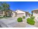 Inviting home featuring a desert landscape, a two-car garage, and a neutral color palette at 1831 S Hudson Dr, Chandler, AZ 85286