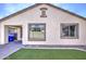 Close up view of the stucco exterior and manicured landscaping of this lovely home at 1831 S Hudson Dr, Chandler, AZ 85286