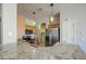 Well-lit kitchen featuring stainless steel appliances, granite countertops, and hanging pendant lights at 1831 S Hudson Dr, Chandler, AZ 85286