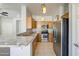 Spacious kitchen featuring stainless steel appliances and granite countertops, with wood cabinetry at 1831 S Hudson Dr, Chandler, AZ 85286