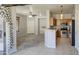 Bright living space next to the kitchen featuring tile floors and contemporary gray walls at 1831 S Hudson Dr, Chandler, AZ 85286