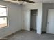 Bedroom with a ceiling fan, window, closet and a neutral carpet at 18361 W Jessie Ln, Surprise, AZ 85387