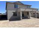 Two-story home exterior showing a covered patio, backyard, and neutral color at 18361 W Jessie Ln, Surprise, AZ 85387