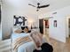 Serene bedroom features soft lighting, a ceiling fan, and a barn door for an inviting atmosphere at 19777 N 76Th N St # 2243, Scottsdale, AZ 85255